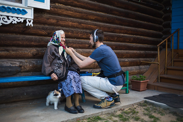 Mikhail Mordasov mikes up Elizaveta Andreyeva before her interview.