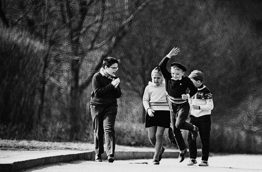 four children walking and having fun together