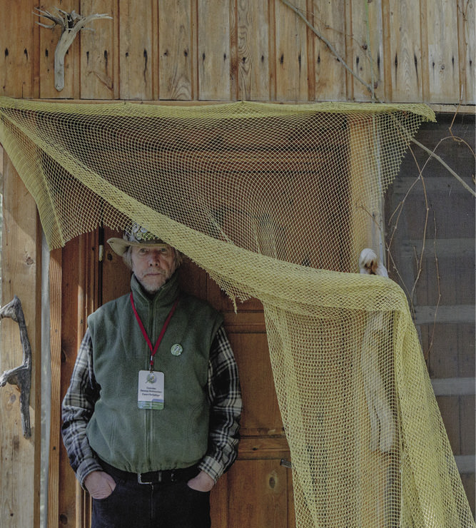 Man standing under a net