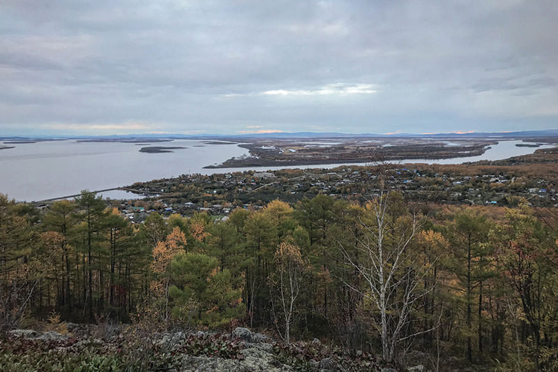 Kids standing around at an overlook.