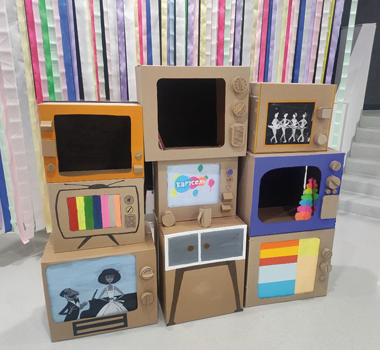 Cardboard "televisions" set up at a Moscow school as part of a September 1 celebration. The Swan Lake ballerinas on the upper right have become a popular oppositionist meme.
