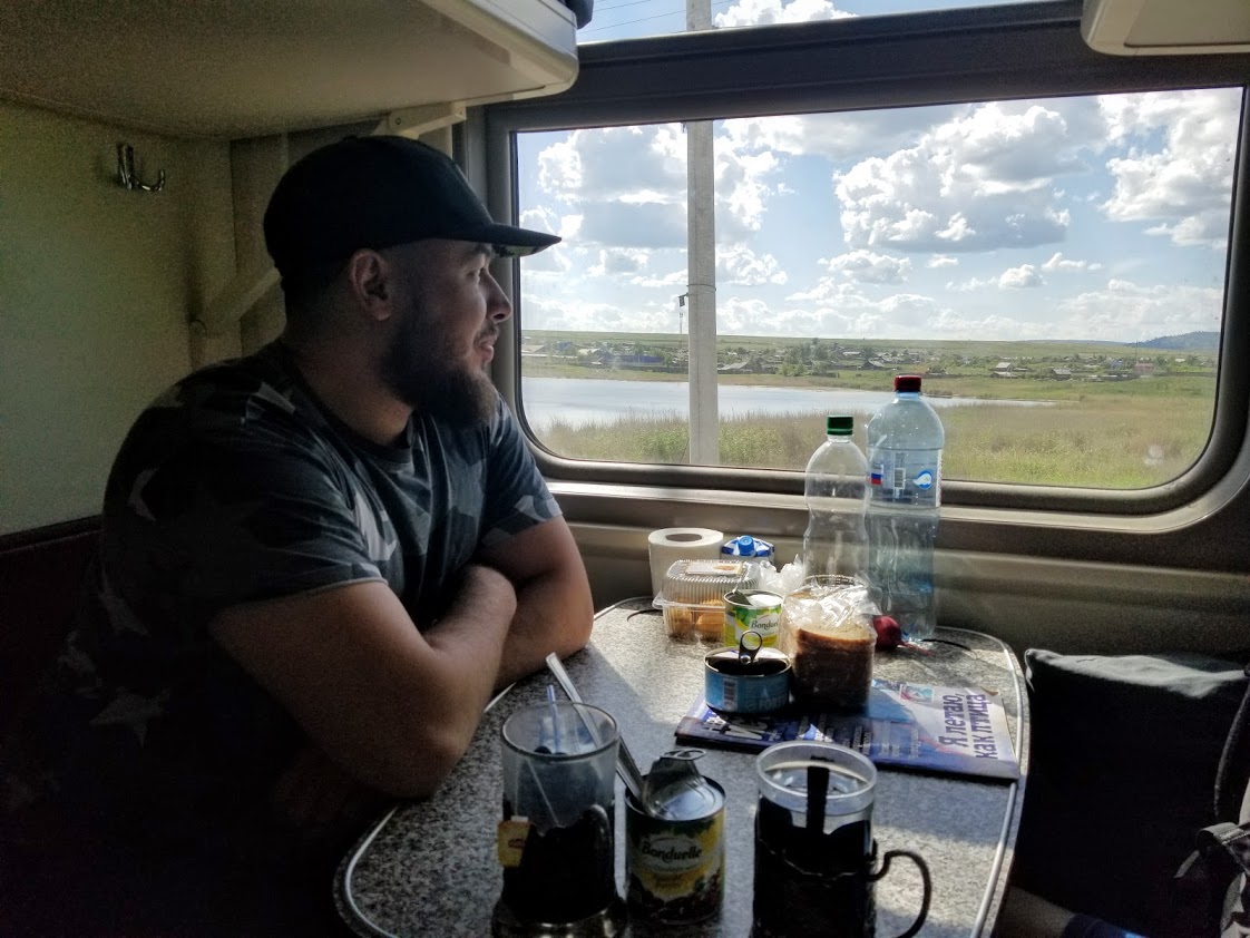 Man looking out window in Siberia