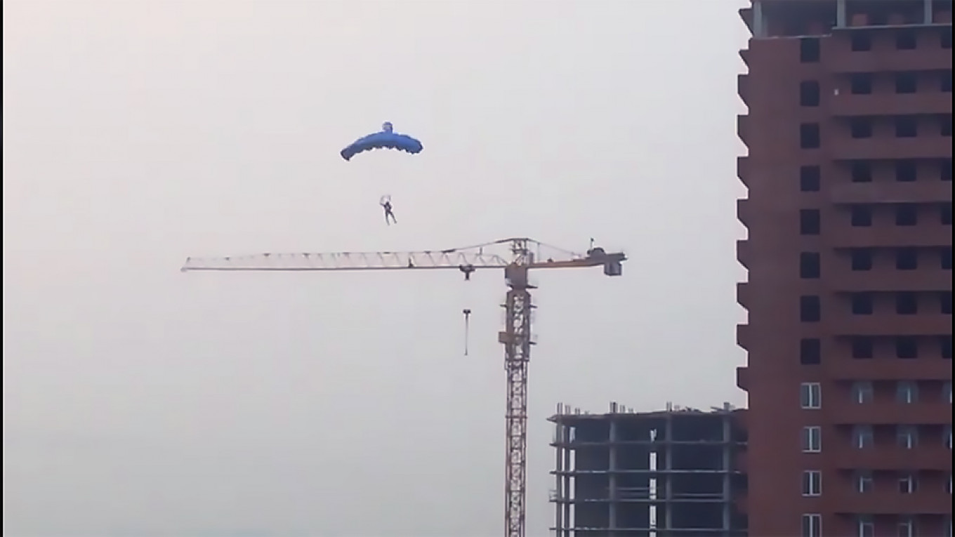 Paragliding off a construction crane