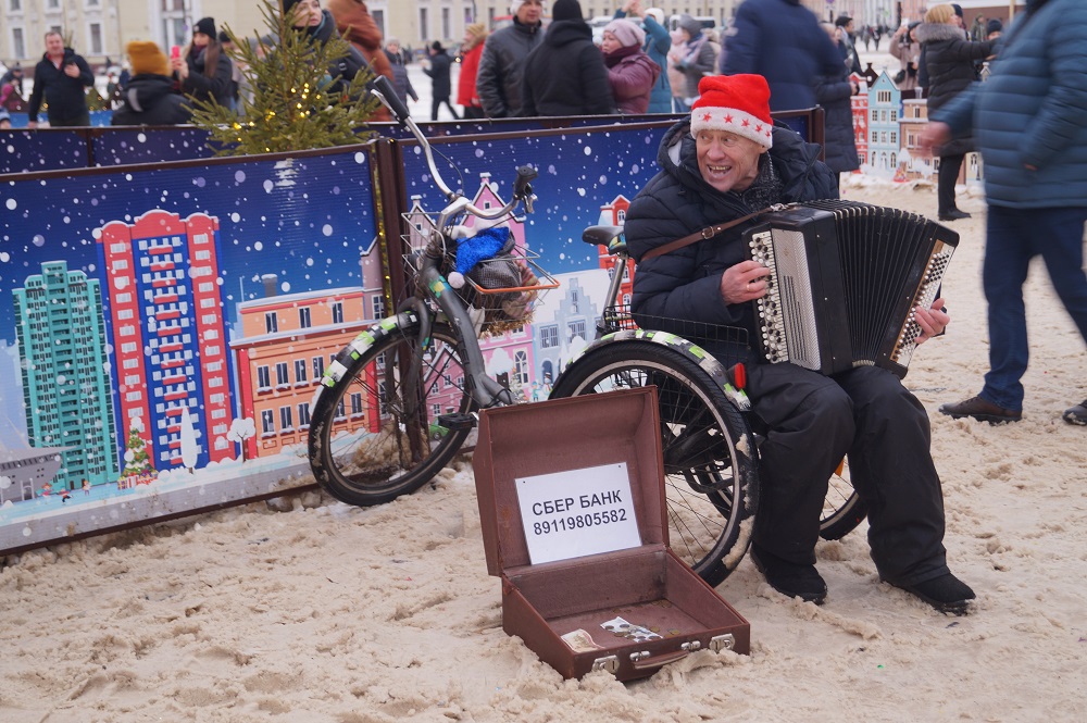 busker playing accordiom