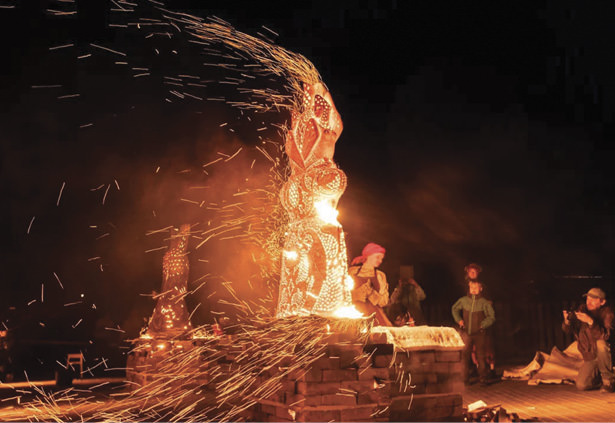 People dancing around a fire