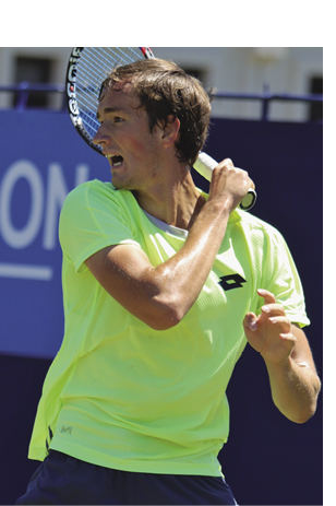 Man holding tennis racquet.