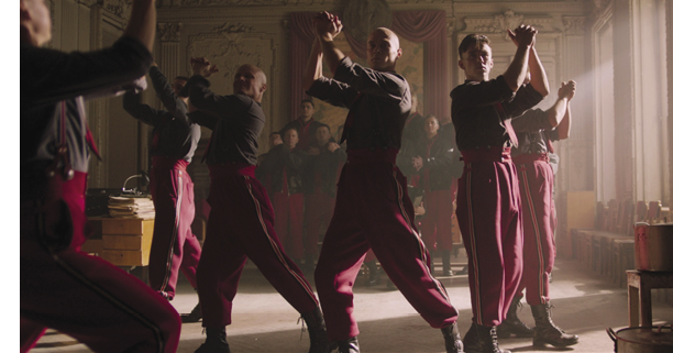 Men dancing in dark room