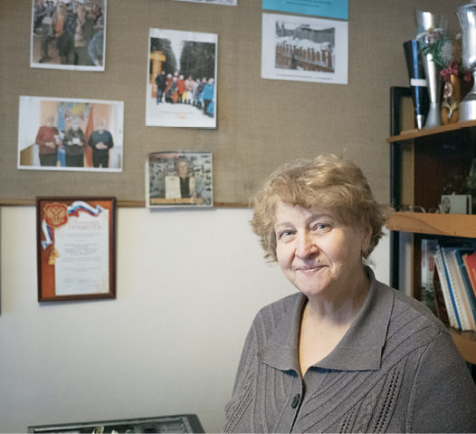 Middle aged woman looking at camera.