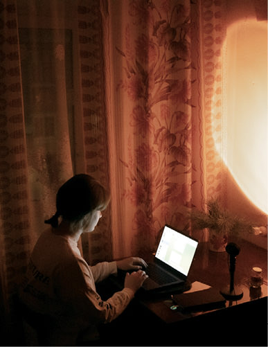 Woman working at a desk.
