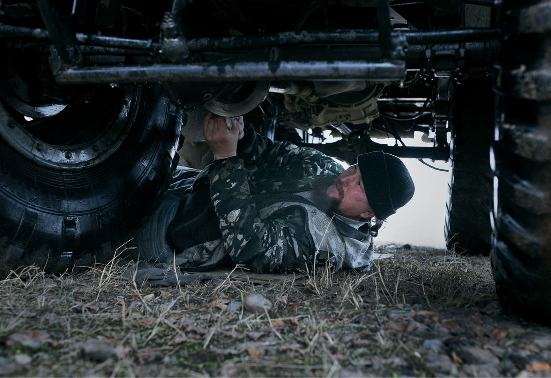 Man underneath a truck