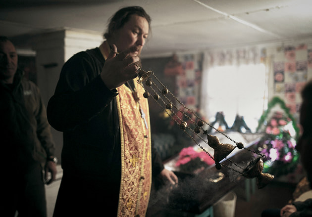 Priest leading a service.