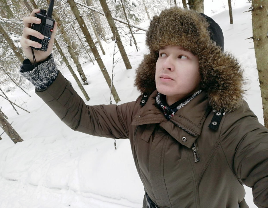 Man holding up walkie talkie