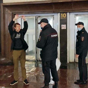 Fellow holding metro card as protest.