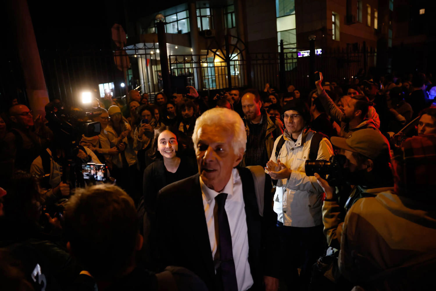 Released political prisoner and lawyer amongst crowd.