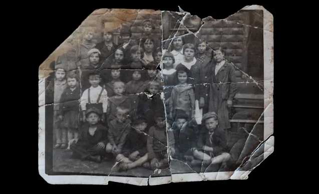 Soviet kids in a yard, posing and looking at camera.