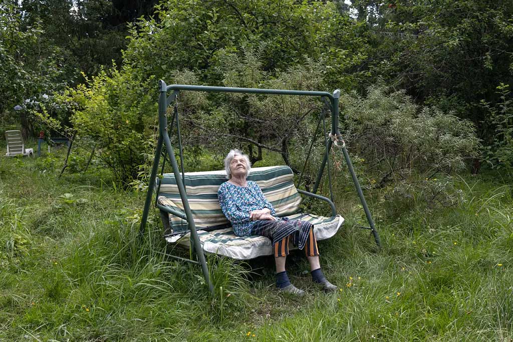 Woman sitting in her garden.