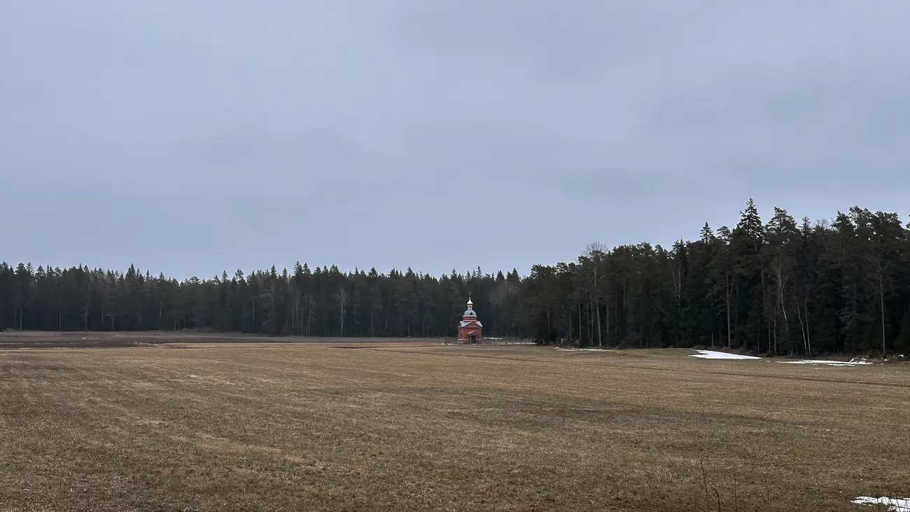 Church chapel in the middle of a field.
