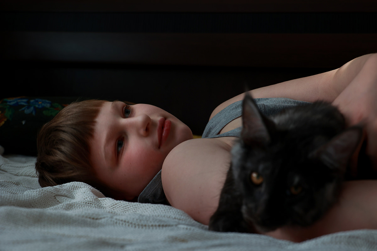 Young boy with cat.
