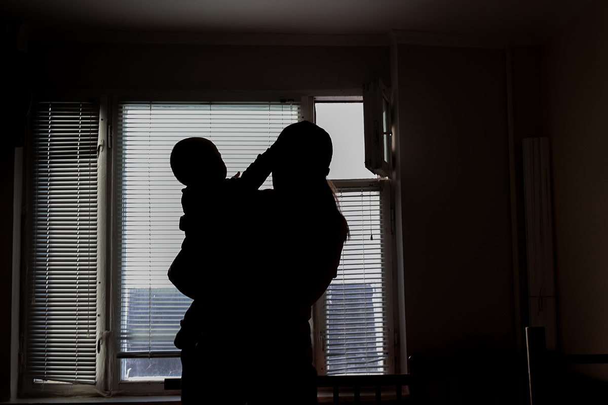 Silhouette of young family.