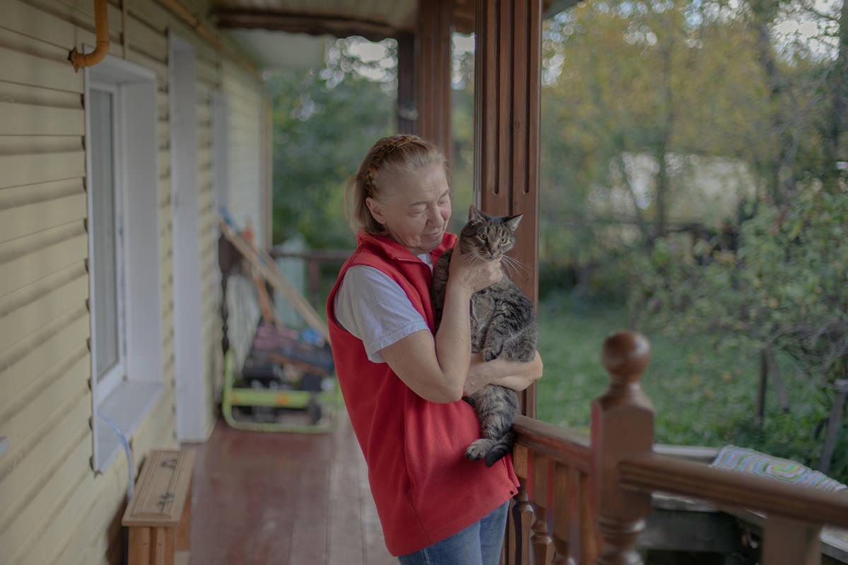 Woman holding a cat.