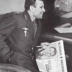 Gagarin reading a newspaper about his own spaceflight in 1961.