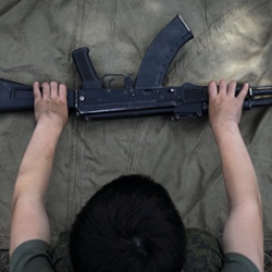 Learning to assemble a gun.<br>